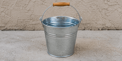 A metal pail — a bucket for carrying water or sand