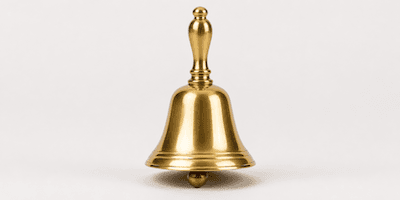 A brass hand bell