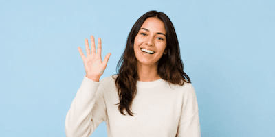 A person waving goodbye